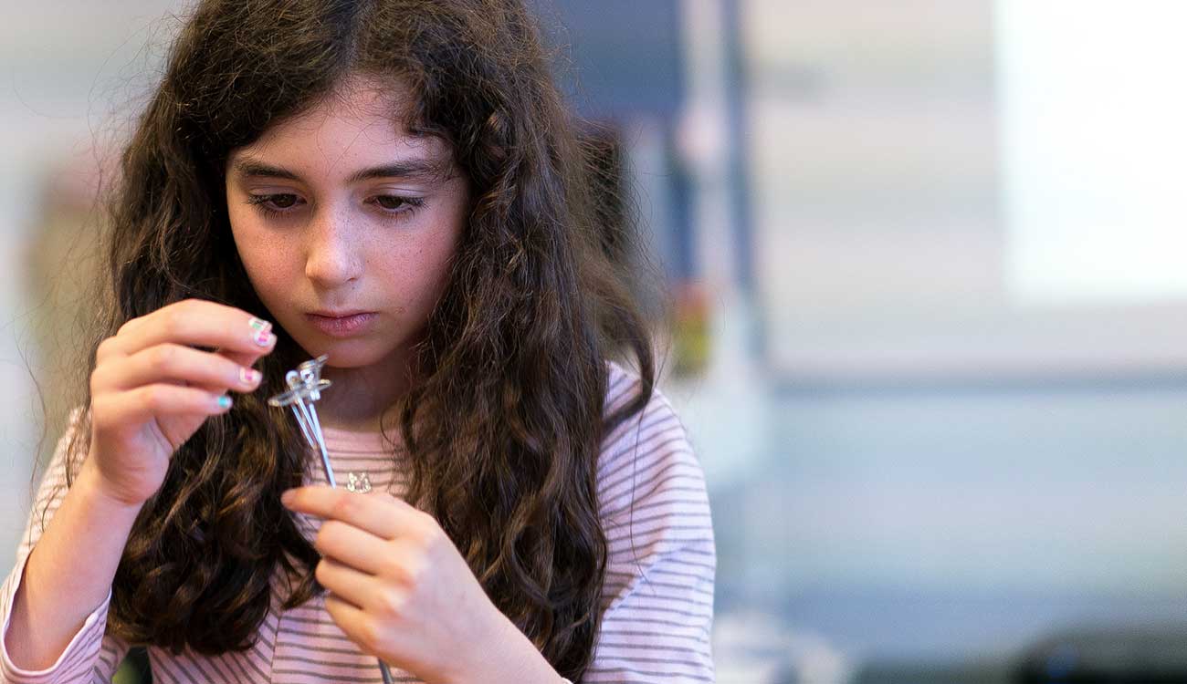 Young child working on science project, Robin Andrews