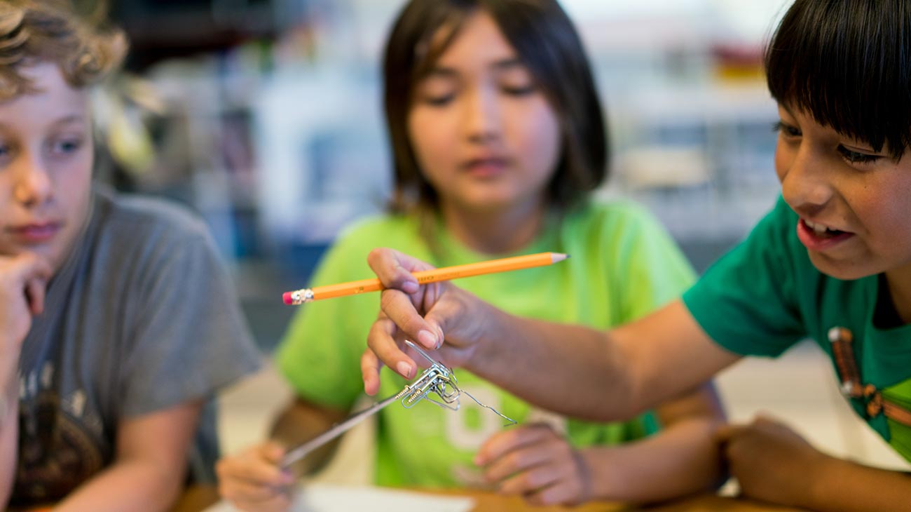 Children working on science project, Robin Andrews