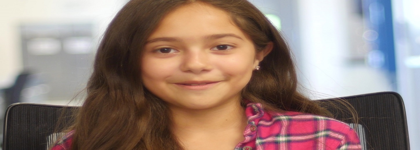 Young child looking through magnifying glass, Robin Andrews